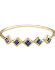 5 Stone Blue Sapphire Ring. 9ct Yellow Gold with a princess cut blue sapphires.