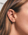 Metier by tomfoolery Large and Original Beaded Hoop Earrings shown on model ear story
