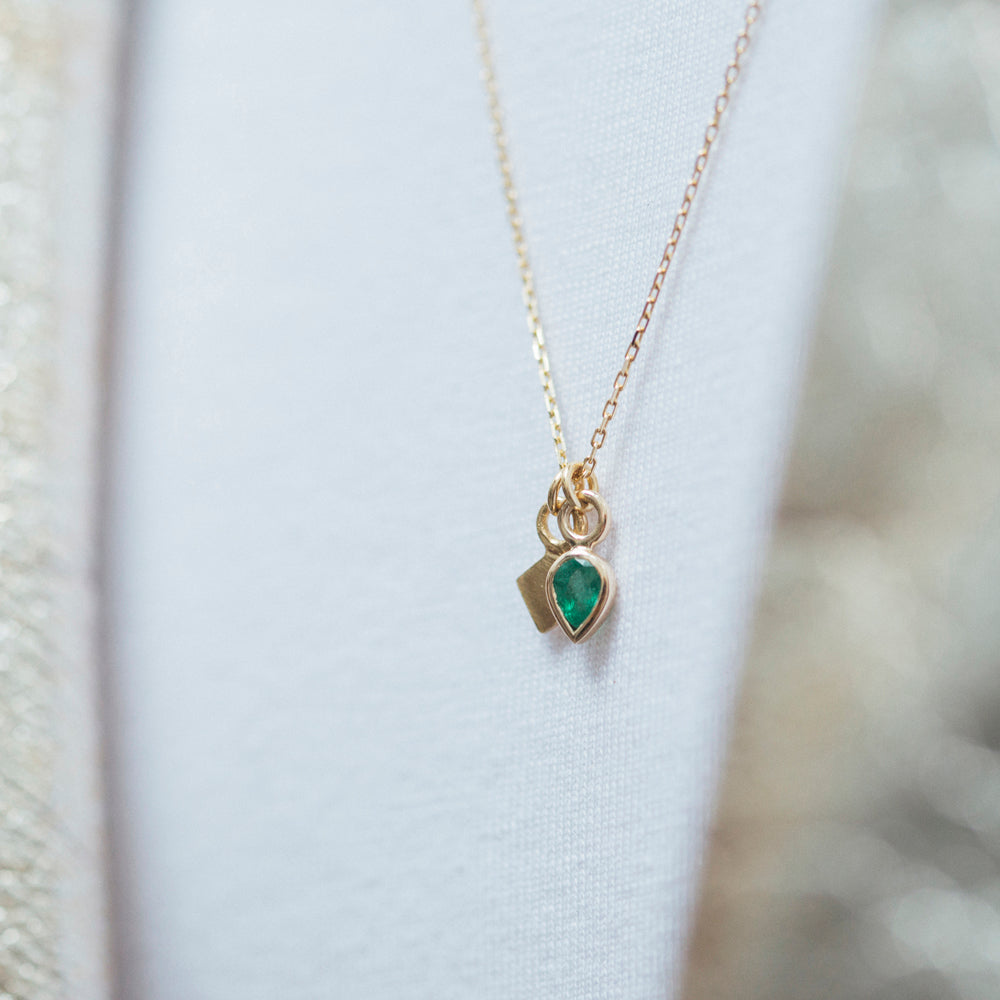 Metier by Tomfoolery pear cut emerald pendant layered with classic gold square plaque