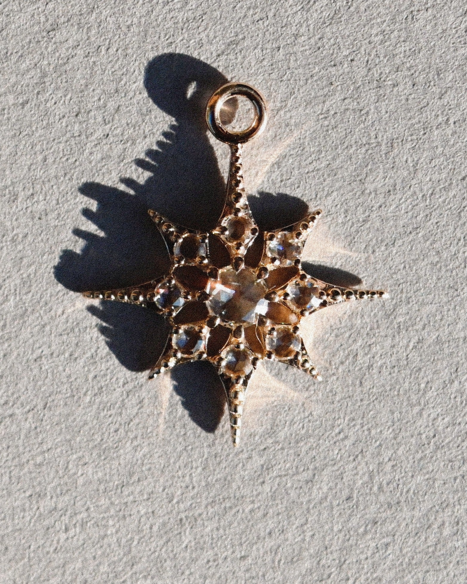 Astra Rose Cut Diamond Star Plaque layerd on white background metier by tomfoolery