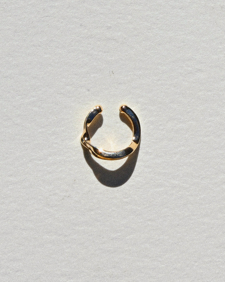 Rondelle Double Curve Ear Cuff on grey