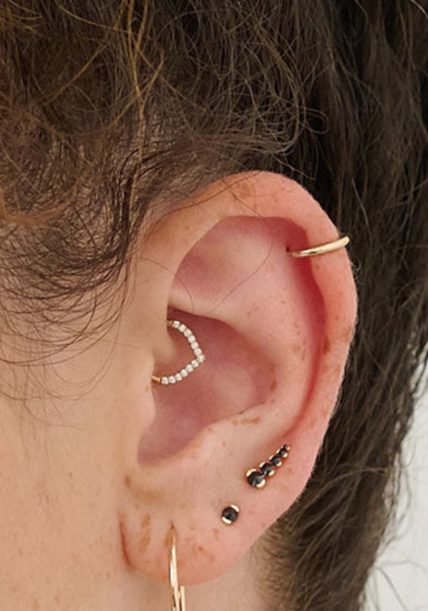 metier by tomfoolery model wearing ear story featuring Daith V Diamond Clicker
