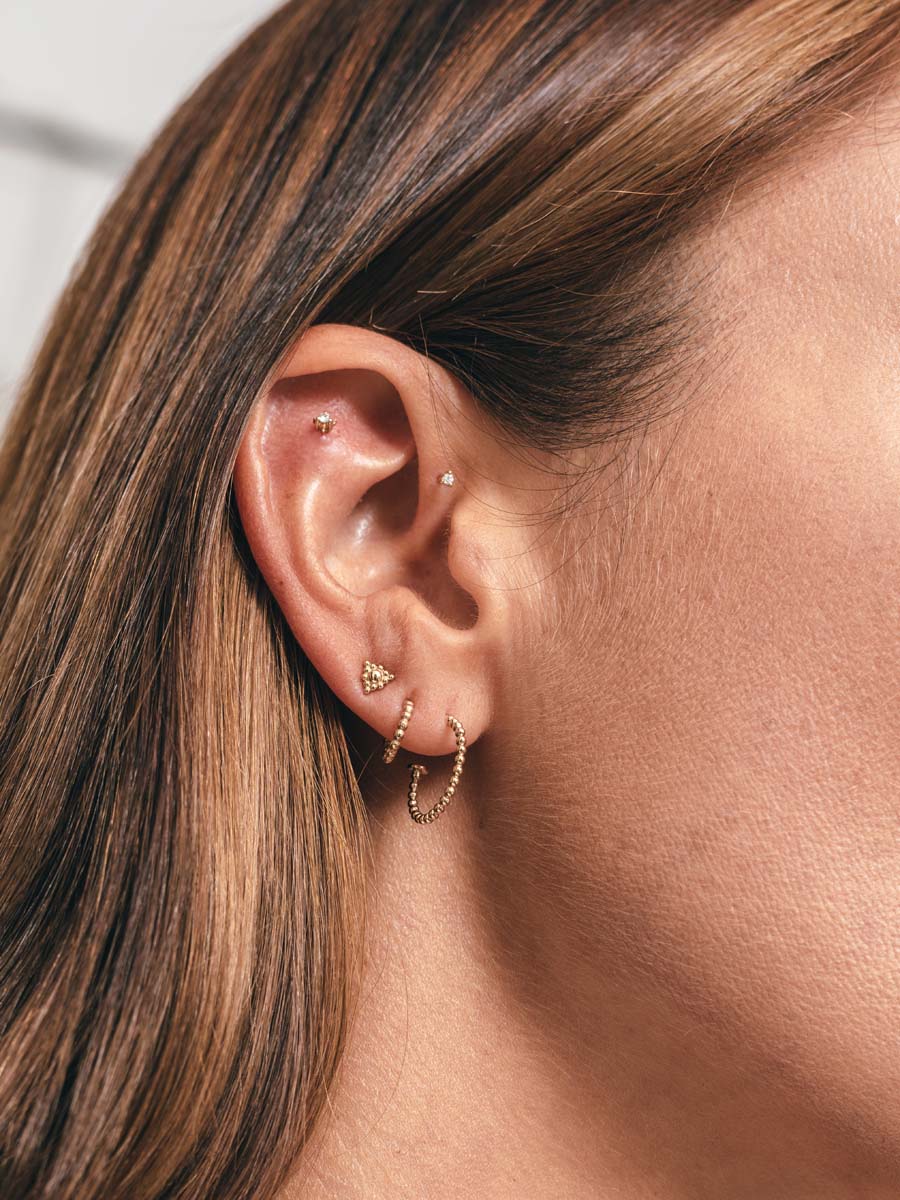 Metier by tomfoolery Large and Original Beaded Hoop Earrings shown on model ear story
