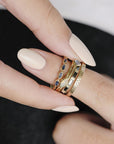 Métier by tomfoolery 5 stone stacking ring in marquise blue sapphires styled with opal stacking ring, dala band and black diamond baguette cut eternity ring.